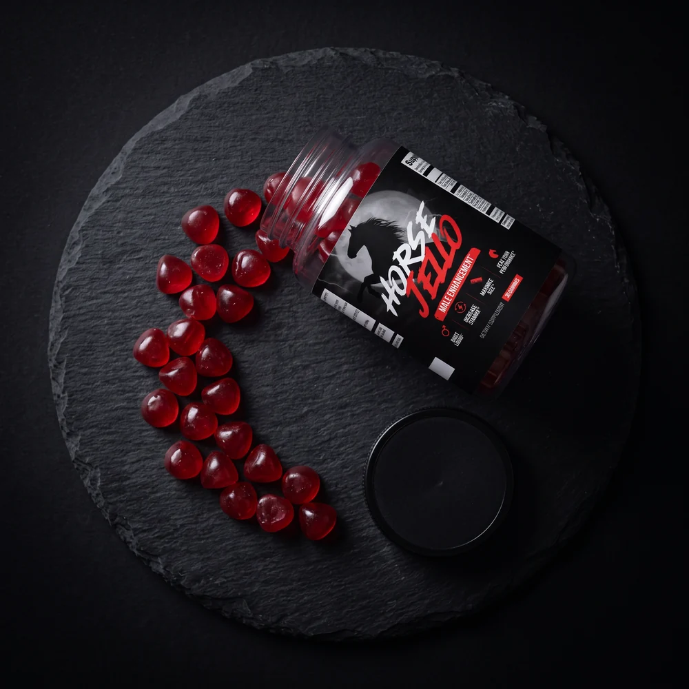 Horse Jello® jar with red gummies on slate